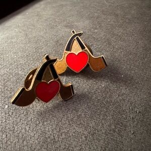 Two vintage peace pipe pins